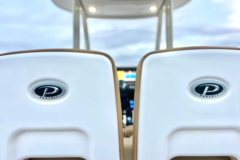 Slide: The Image of 2017 Pursuit C 238 Center Console boat seats with logo, showcasing luxury design. - 74
