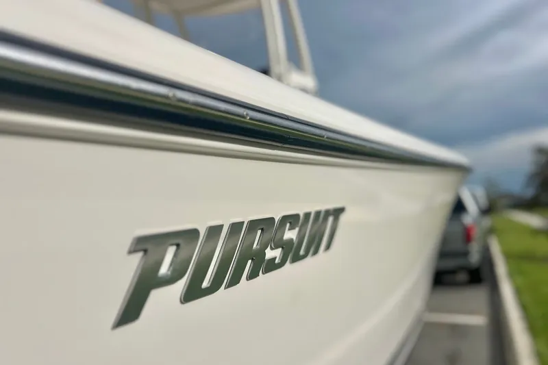 Slide: The Image of 2017 Pursuit C 238 Center Console boat with logo in focus. - 4