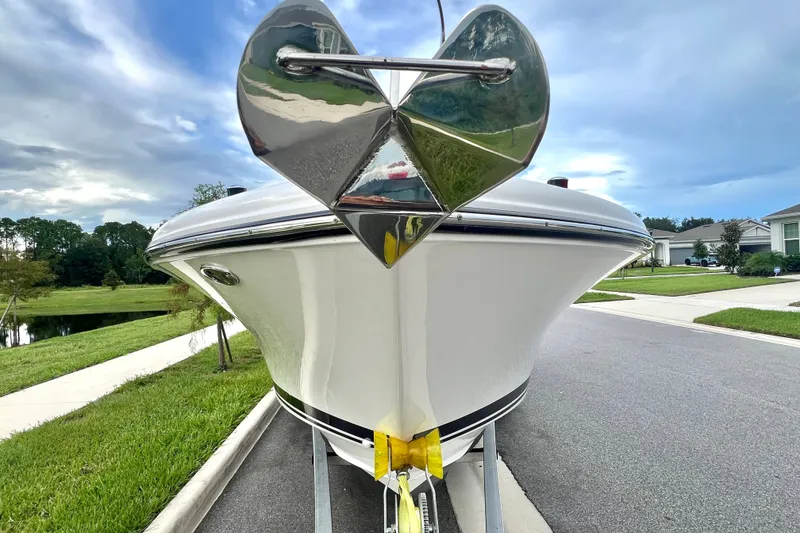 Slide: The Image of 2017 Pursuit C 238 Center Console boat on trailer, parked in suburban neighborhood. - 18