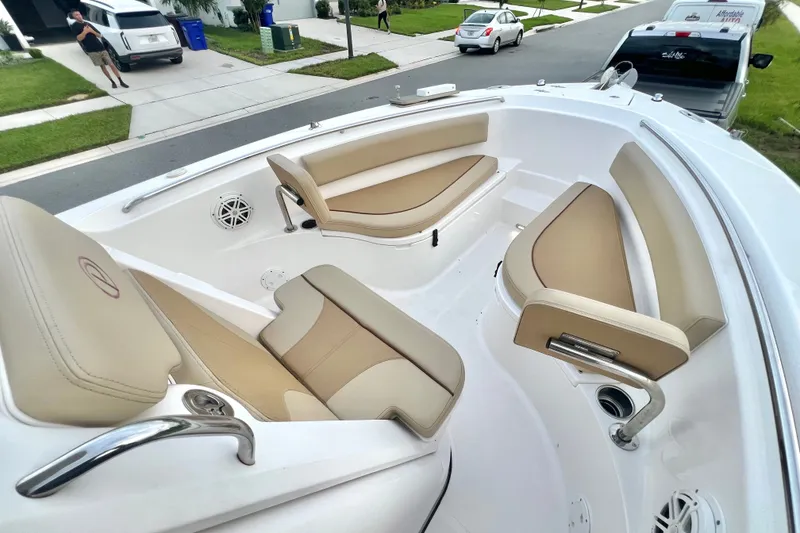 Slide: The Image of 2017 Pursuit C 238 Center Console boat with beige seating and modern design. - 62