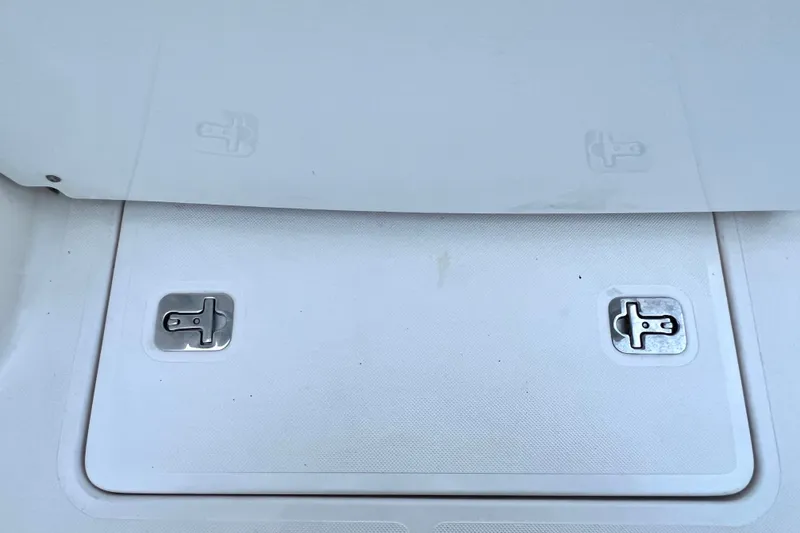 Slide: The Image of 2017 Pursuit C 238 Center Console deck with stainless steel latches. - 89