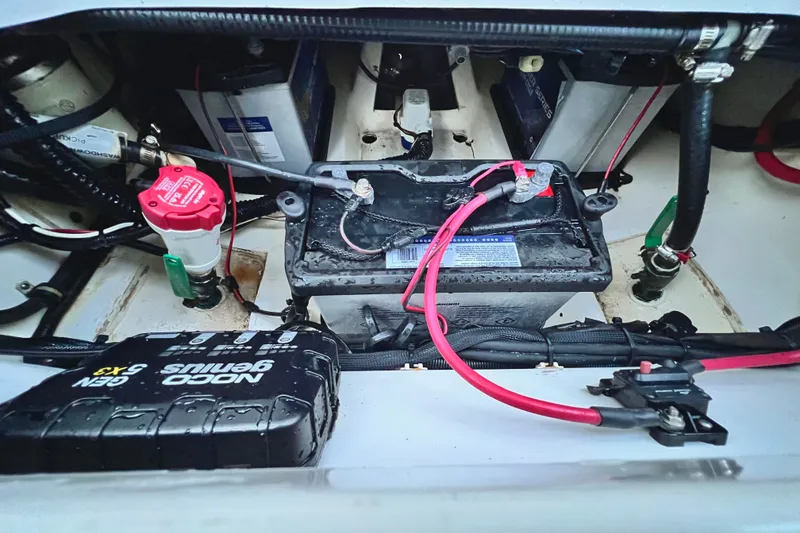 Slide: The Image of Battery compartment of a 2017 Pursuit C 238 Center Console boat. - 90