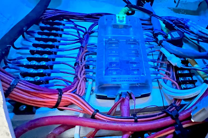 Slide: The Image of Electrical wiring and fuse box in a 2017 Pursuit C 238 Center Console boat. - 92