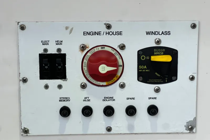 Slide: The Image of Control panel of a 2017 Pursuit C 238 Center Console boat with switches and dials. - 83
