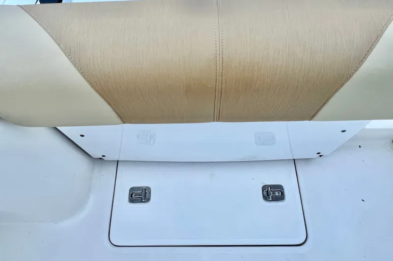 Slide: The Image of 2017 Pursuit C 238 Center Console seat and storage compartment detail. - 88