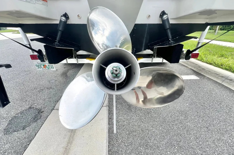 Slide: The Image of Rear view of a 2017 Pursuit C 238 Center Console boat with shiny propeller. - 11