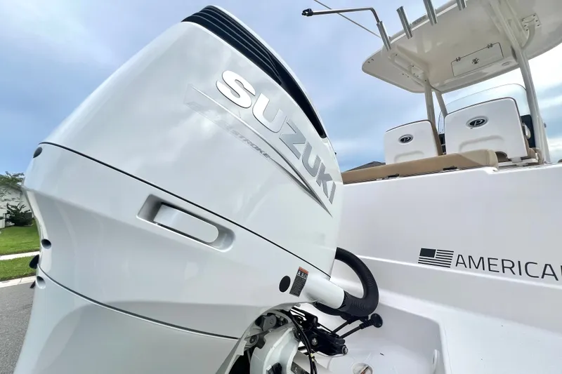 Slide: The Image of 2017 Pursuit C 238 Center Console with Suzuki outboard motor, showcasing sleek design. - 7