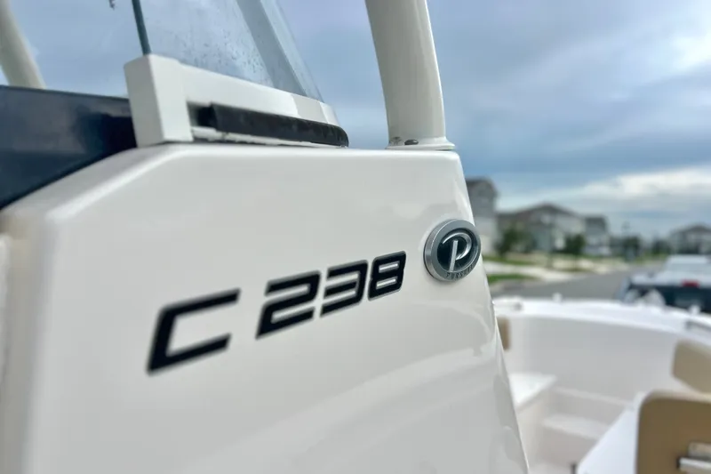 Slide: The Image of 2017 Pursuit C 238 Center Console boat, close-up of model emblem. - 54