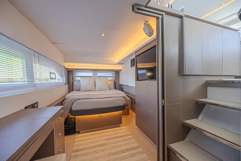 Slide: The Image of Luxurious interior of 2025 Leopard 53 Powercat yacht, featuring a cozy bedroom and modern design. - 56