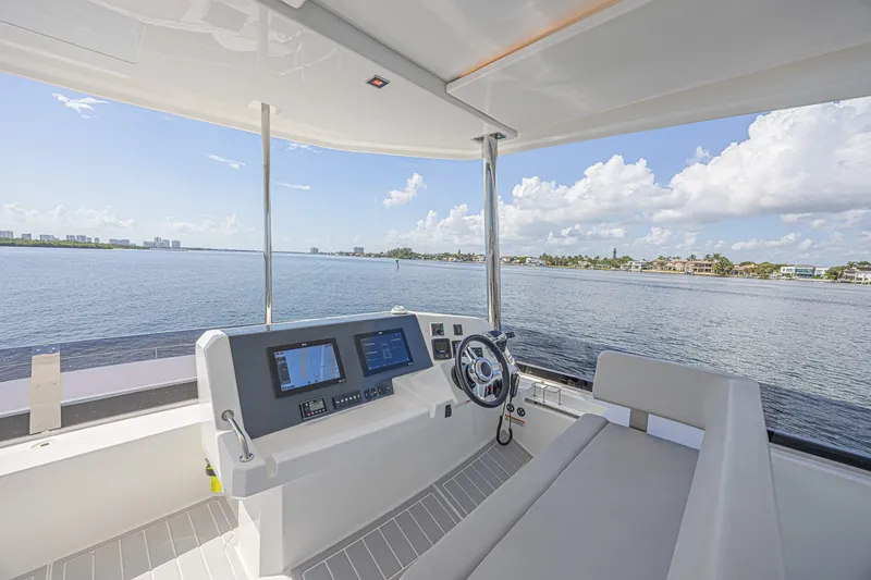 Slide: The Image of Helm of 2025 Leopard 53 Powercat with panoramic water views and modern navigation equipment. - 28