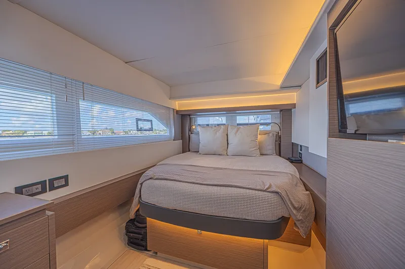 Slide: The Image of Luxurious bedroom interior of 2025 Leopard 53 Powercat yacht with modern design and ambient lighting. - 55