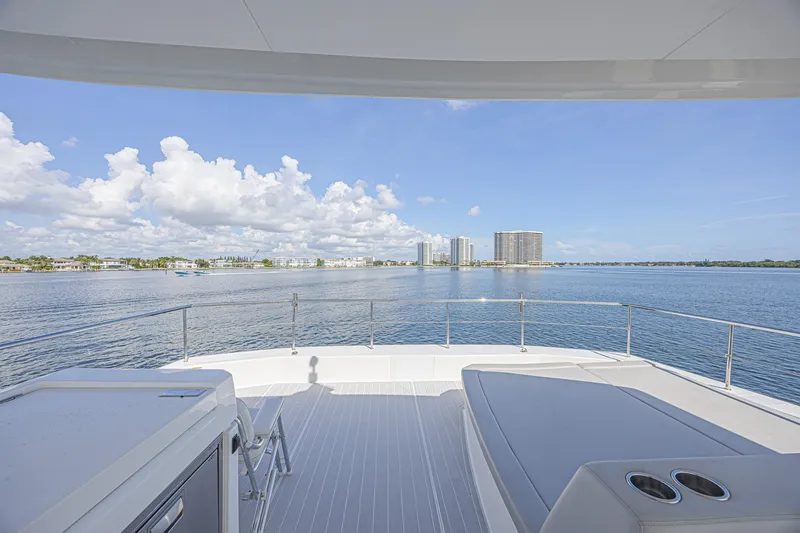 Slide: The Image of Leopard 53 Powercat 2025 yacht deck with ocean view and city skyline. - 23