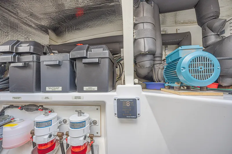 Slide: The Image of Engine room of 2025 Leopard 53 Powercat with batteries and machinery components. - 73