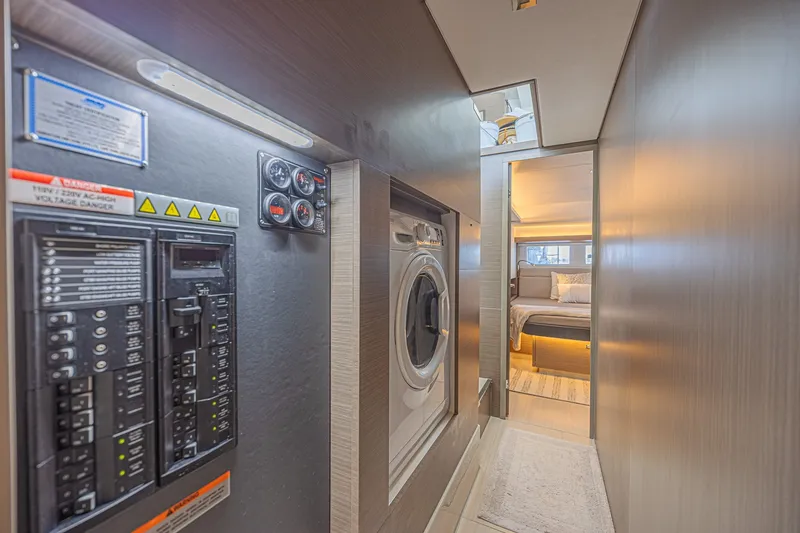 Slide: The Image of Laundry area and bedroom in 2025 Leopard 53 Powercat yacht, featuring modern design and amenities. - 48
