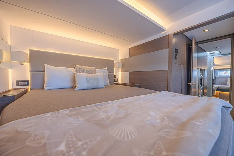 Slide: The Image of Luxurious bedroom interior of 2025 Leopard 53 Powercat yacht, featuring elegant bedding and modern lighting. - 51