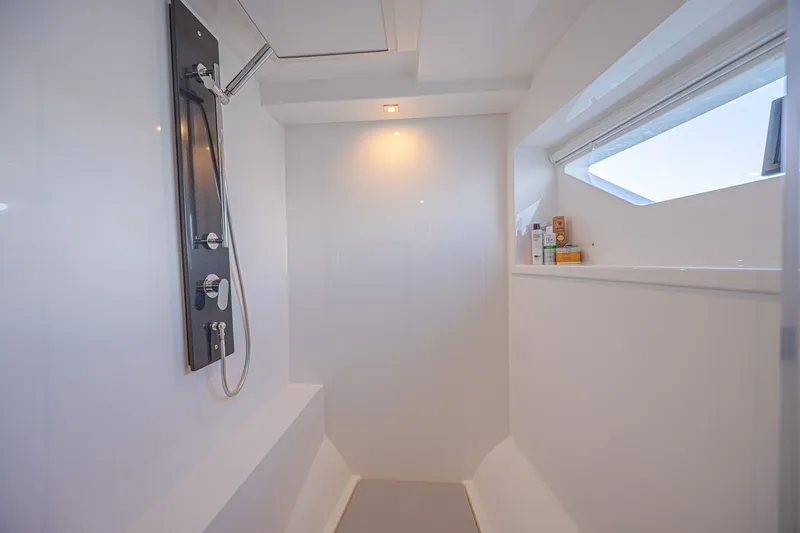 Slide: The Image of Modern shower area in 2025 Leopard 53 Powercat yacht, featuring sleek design and window view. - 61