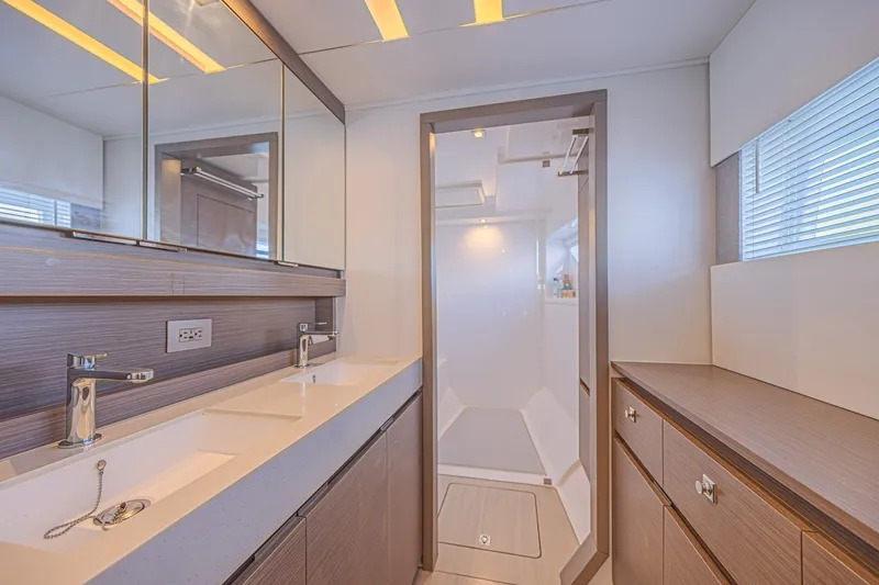 Slide: The Image of Luxurious bathroom interior of 2025 Leopard 53 Powercat yacht, featuring modern fixtures and ample storage. - 62