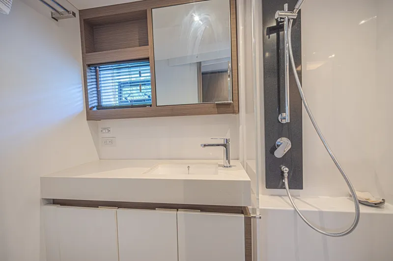 Slide: The Image of Modern bathroom interior of 2025 Leopard 53 Powercat yacht, featuring sleek sink and shower design. - 49