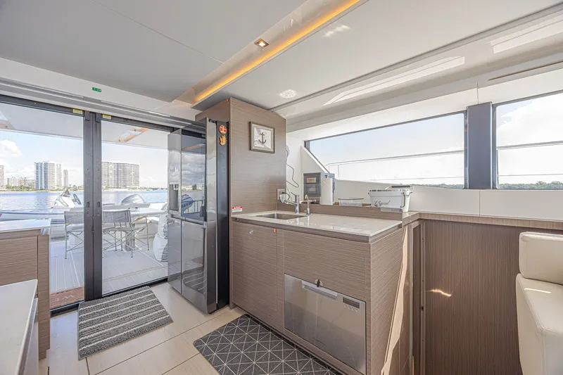 Slide: The Image of Luxurious interior of 2025 Leopard 53 Powercat yacht with modern kitchen and scenic views. - 34