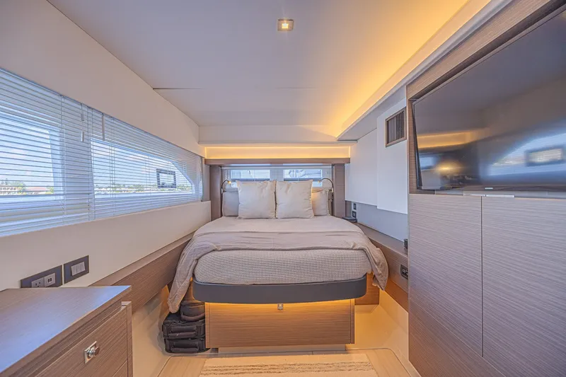 Slide: The Image of Luxurious bedroom interior of 2025 Leopard 53 Powercat yacht with modern design and ambient lighting. - 53