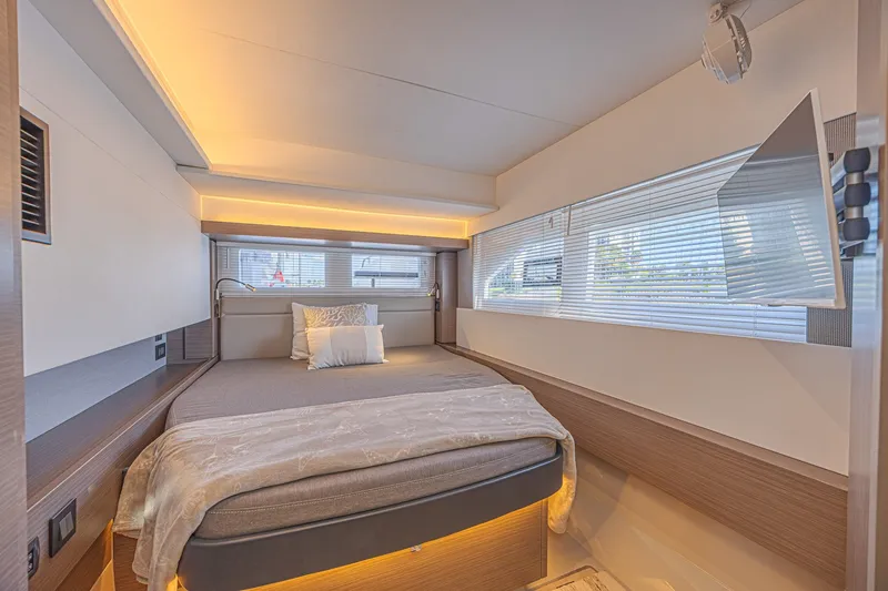 Slide: The Image of Luxurious bedroom interior of 2025 Leopard 53 Powercat yacht with modern design and ambient lighting. - 45