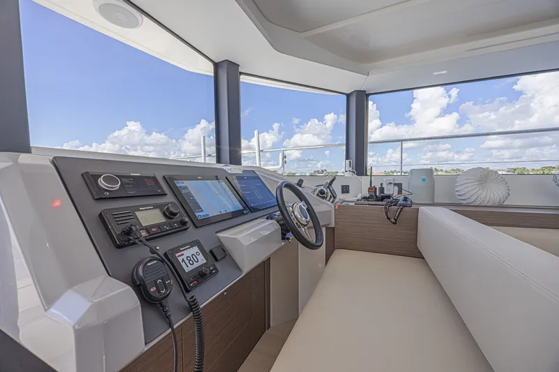 Slide: The Image of Helm station of 2025 Leopard 53 Powercat with modern navigation equipment and panoramic views. - 39