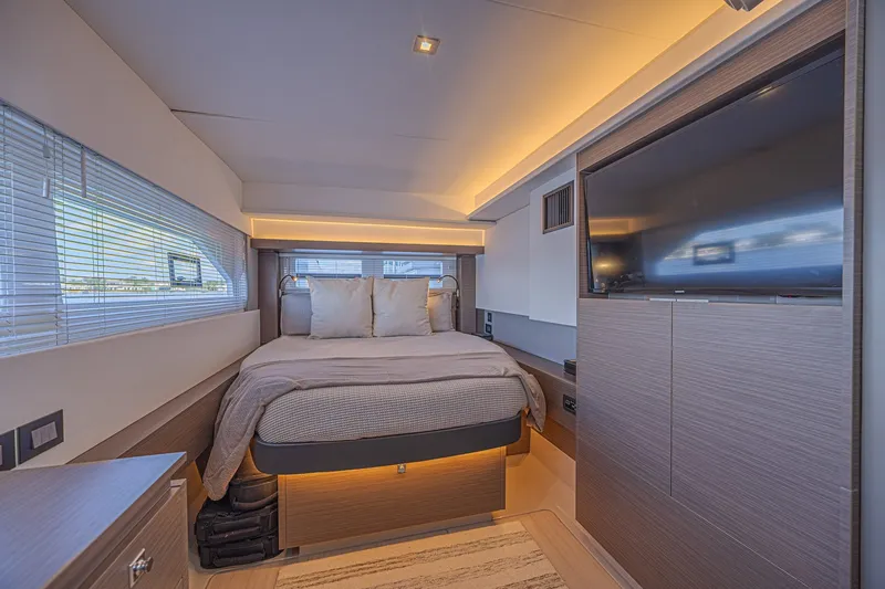 Slide: The Image of Luxurious bedroom interior of 2025 Leopard 53 Powercat yacht with modern design and ambient lighting. - 54