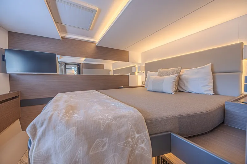 Slide: The Image of Luxurious bedroom interior of 2025 Leopard 53 Powercat yacht with modern design and cozy bedding. - 50