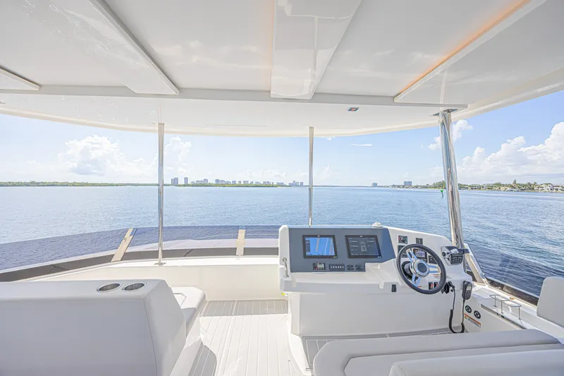 Slide: The Image of Helm of 2025 Leopard 53 Powercat overlooking serene ocean view. - 27