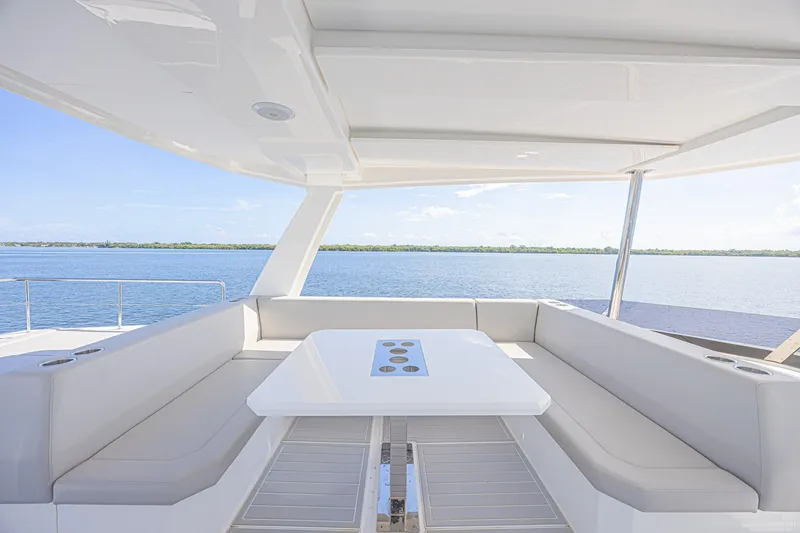 Slide: The Image of Luxurious seating area on 2025 Leopard 53 Powercat yacht overlooking serene waters. - 24