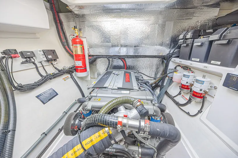 Slide: The Image of Engine room of 2025 Leopard 53 Powercat with modern equipment and fire extinguisher. - 72
