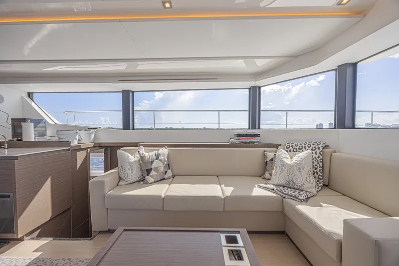 Slide: The Image of Luxurious interior of 2025 Leopard 53 Powercat yacht with elegant seating and panoramic windows. - 38