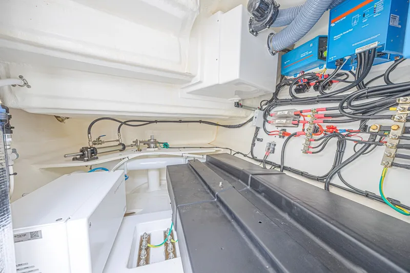 Slide: The Image of Engine room of 2025 Leopard 53 Powercat, showcasing wiring and mechanical components. - 74