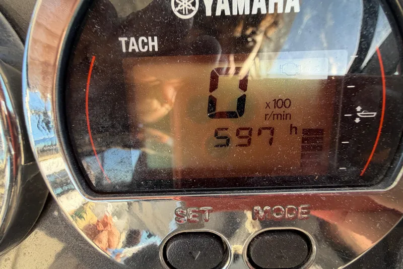 Slide: The Image of Yamaha tachometer displaying 597 hours on a 2017 Robalo R265 Walkaround boat. - 31
