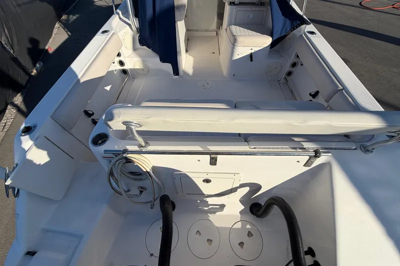 Slide: The Image of 2017 Robalo R265 Walkaround boat interior with seating and storage compartments. - 16
