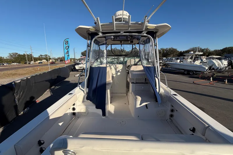 Slide: The Image of 2017 Robalo R265 Walkaround boat on display at a dealership. - 15