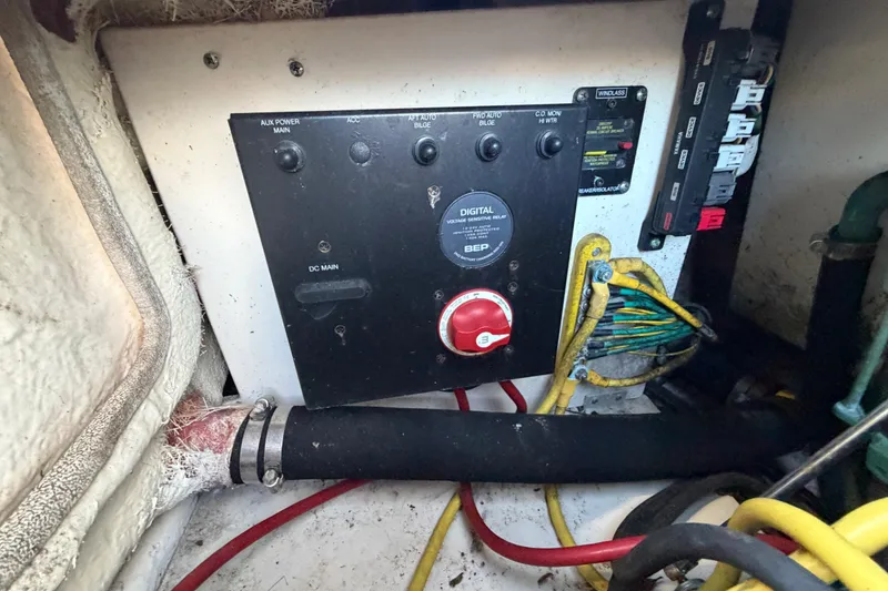 Slide: The Image of Electrical panel of 2017 Robalo R265 Walkaround boat with wiring and switches. - 61