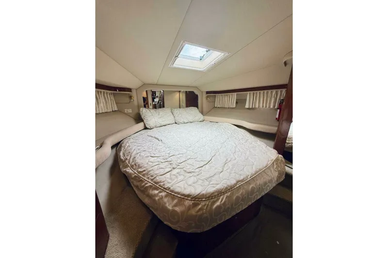 Slide: The Image of Luxurious bedroom interior of 2003 Sea Ray 480 Motor Yacht with cozy bedding. - 22