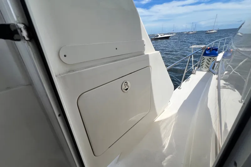 Slide: The Image of 2003 Sea Ray 480 Motor Yacht deck view with ocean and boats in background. - 82
