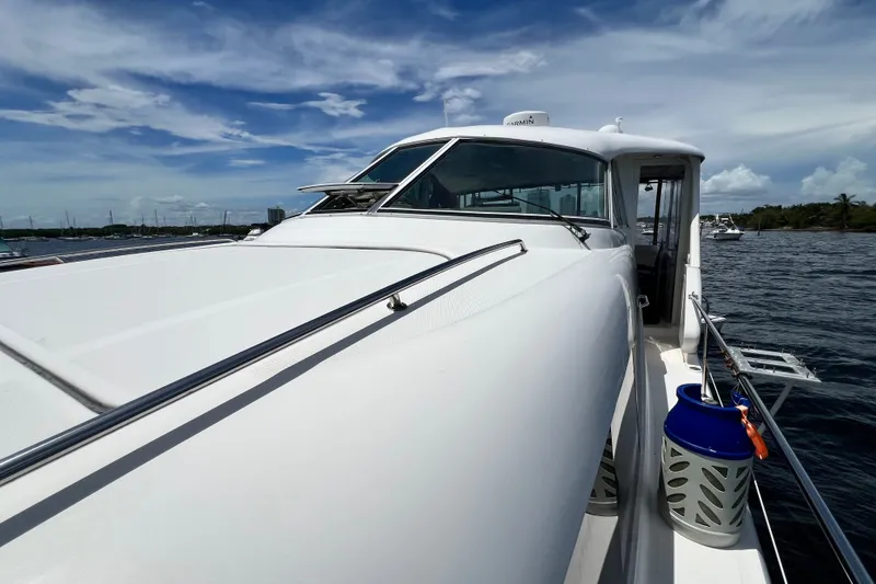 Slide: The Image of 2003 Sea Ray 480 Motor Yacht cruising on a sunny day with clear skies. - 77