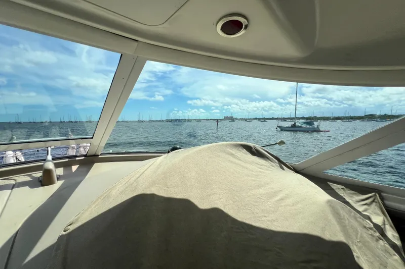Slide: The Image of View from 2003 Sea Ray 480 Motor Yacht, overlooking a serene harbor with sailboats. - 169
