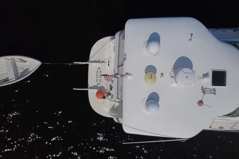 Slide: The Image of Aerial view of 2003 Sea Ray 480 Motor Yacht with small boat attached. - 198