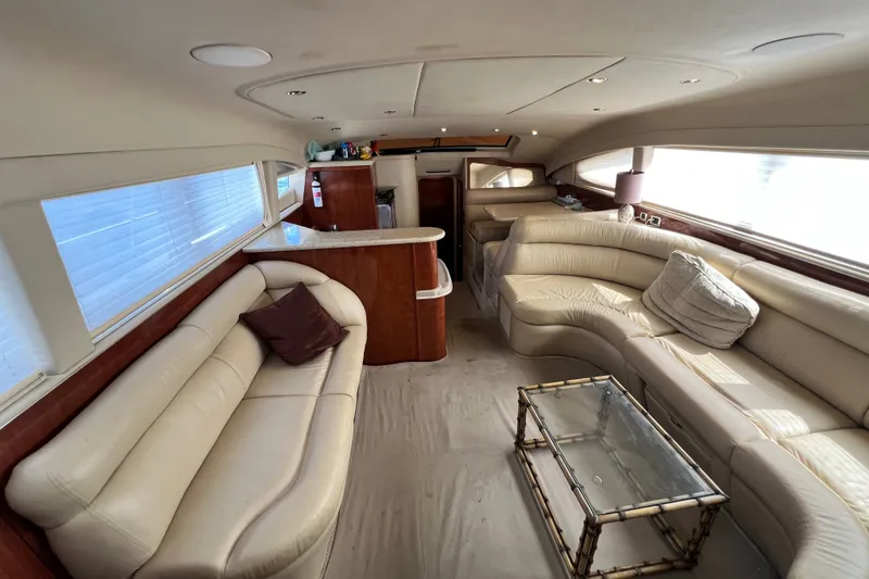 Slide: The Image of Luxurious interior of a 2003 Sea Ray 480 Motor Yacht with plush seating and elegant decor. - 158