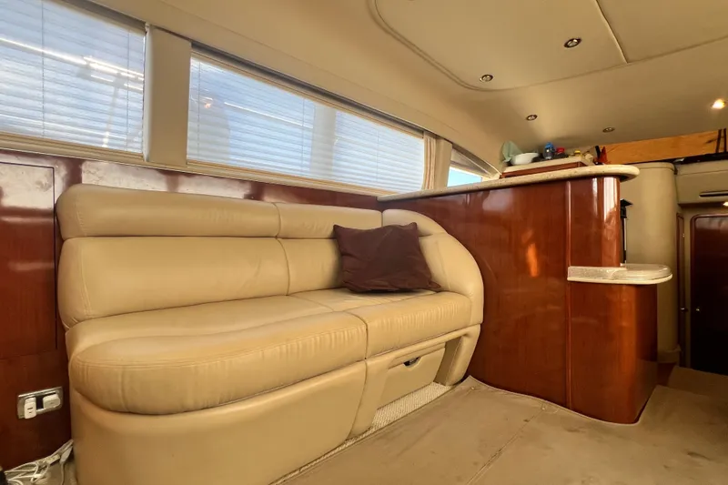 Slide: The Image of Luxurious interior of 2003 Sea Ray 480 Motor Yacht with beige leather seating. - 155