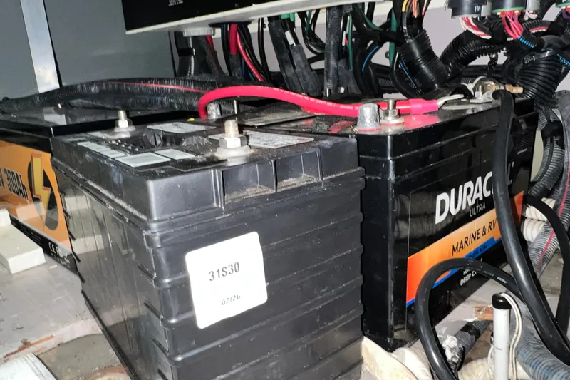 Slide: The Image of Marine batteries in a 2003 Sea Ray 480 Motor Yacht engine compartment. - 48