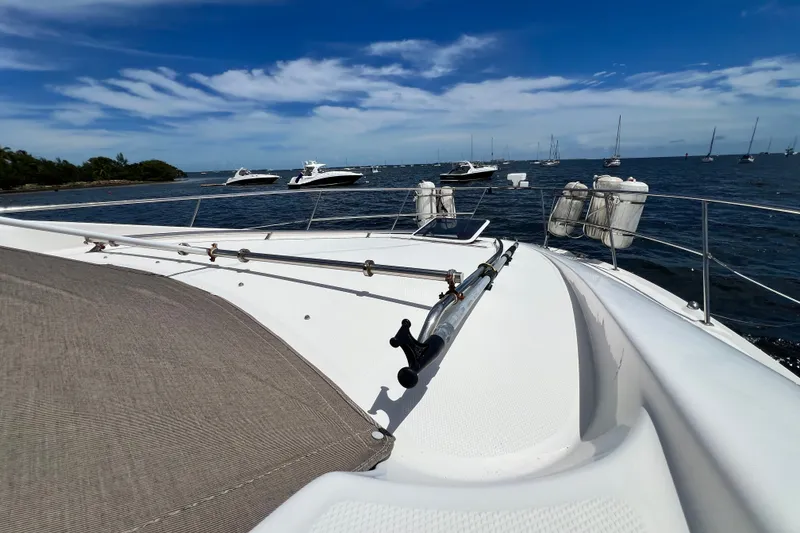 Slide: The Image of 2003 Sea Ray 480 Motor Yacht on calm waters with clear blue sky. - 70
