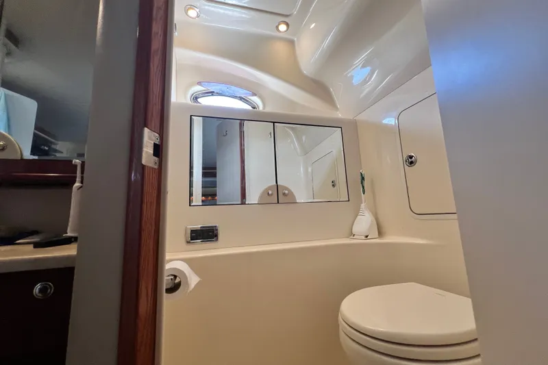 Slide: The Image of Bathroom interior of 2003 Sea Ray 480 Motor Yacht with mirror and toilet. - 129
