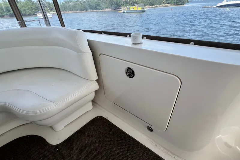 Slide: The Image of White seating area on 2003 Sea Ray 480 Motor Yacht, overlooking water. - 84
