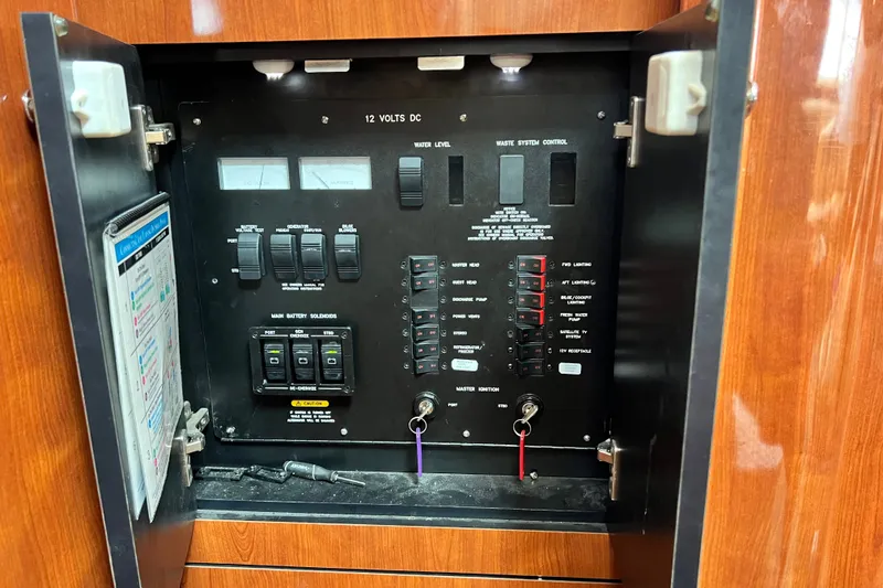 Slide: The Image of Electrical control panel inside a 2003 Sea Ray 480 Motor Yacht. - 149