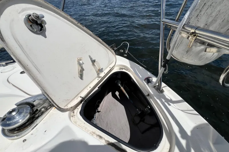 Slide: The Image of Open hatch on 2003 Sea Ray 480 Motor Yacht, revealing storage compartment by the water. - 66